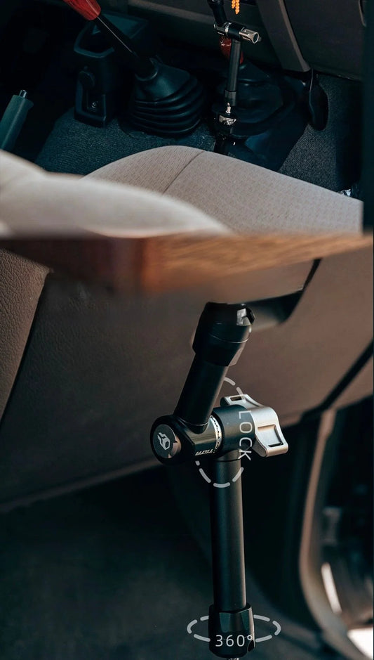 Car interior with a multifunction iron arm extension attached to the driver's seat floor