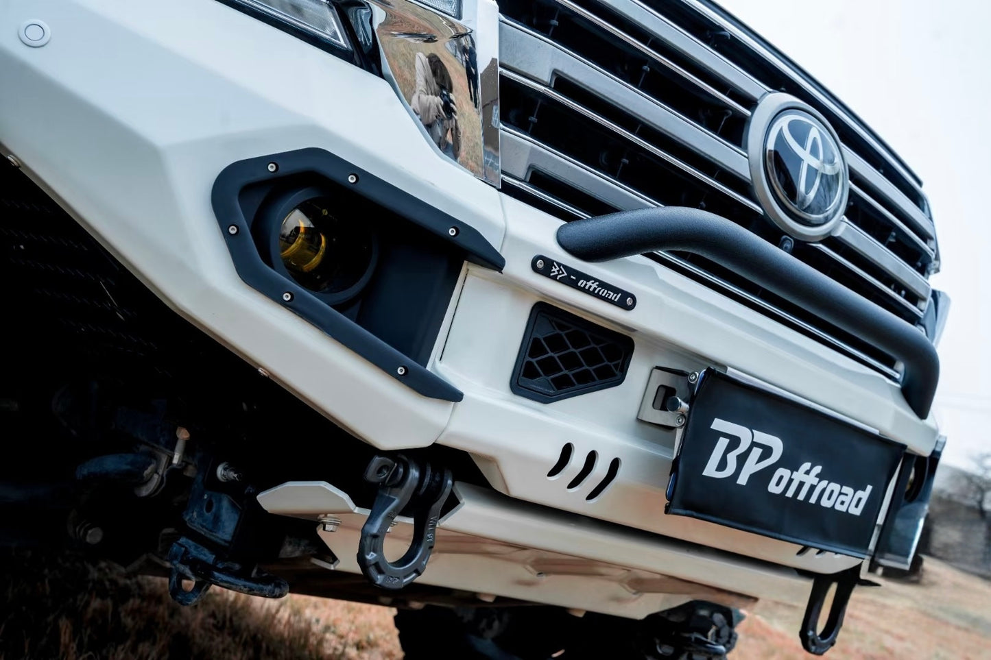 Close-up of a Toyota vehicle with BP Offroad branding on the white bumper