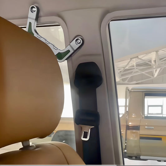 LC70 Series Aluminum Roof Grab Handle - Rear/B-pillar grab handle installed above the seatbelt, demonstrating the secure, strong mounting for rear passengers