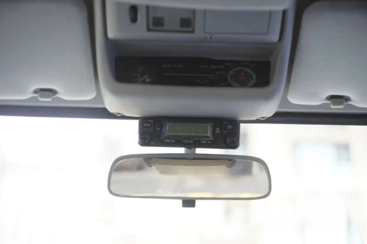 Radio holder mounted in Lexus LX450 interior with rear view mirror and altitude meter