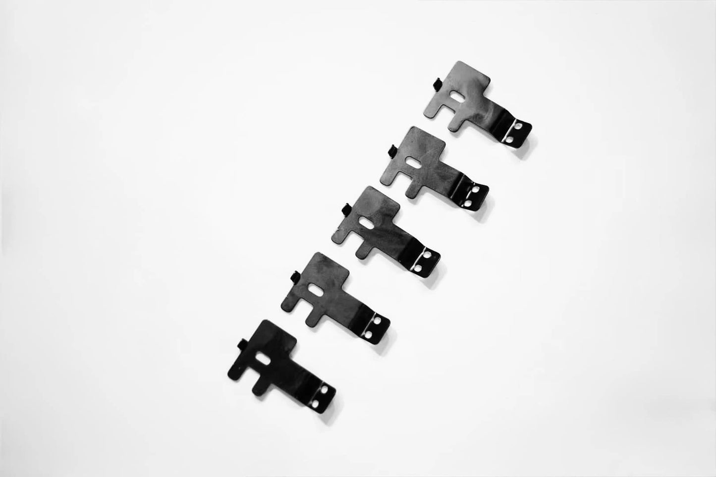 Close-up multiple piece of custom cb radio bracket for Land Cruiser 80 and LX450