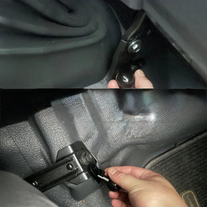 Close-up of a car seat arm lever being adjusted and install by a hand.