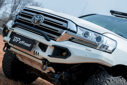 Close-up of a Toyota lc200 facelift with a white BP Offroad bumper in an outdoor setting