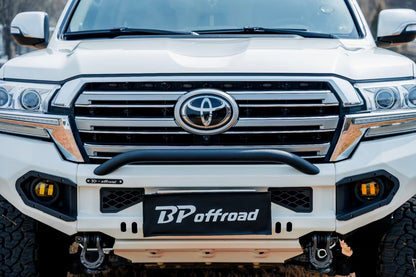 White Toyota lc200 front end vehicle with BP Offroad bumper in a forest setting
