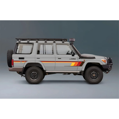 Side view of a gray SUV Land Cruiser 76 with orange and red stripes on a gray background