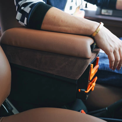 Driver resting arm on LC70 center console armrest demonstrating ergonomic comfort position