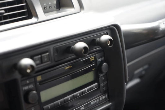Set of dual universal gadgets phone mount installed on Land Cruiser 80 series dash close up zoom
