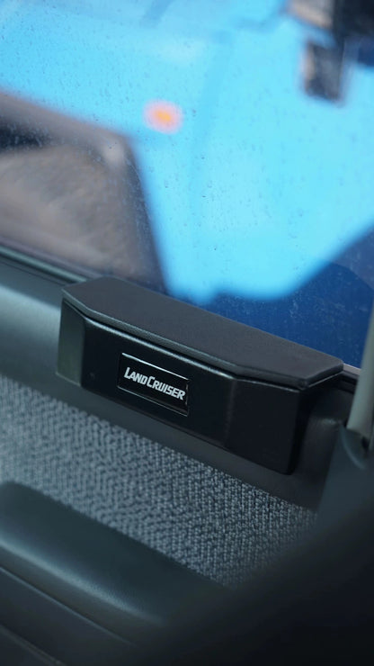 Land Cruiser 80 series door armrest pad installed on interior door panel