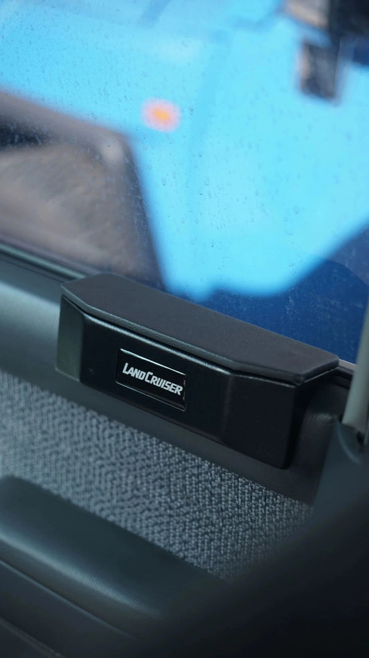 Land Cruiser 80 series door armrest pad installed on interior door panel