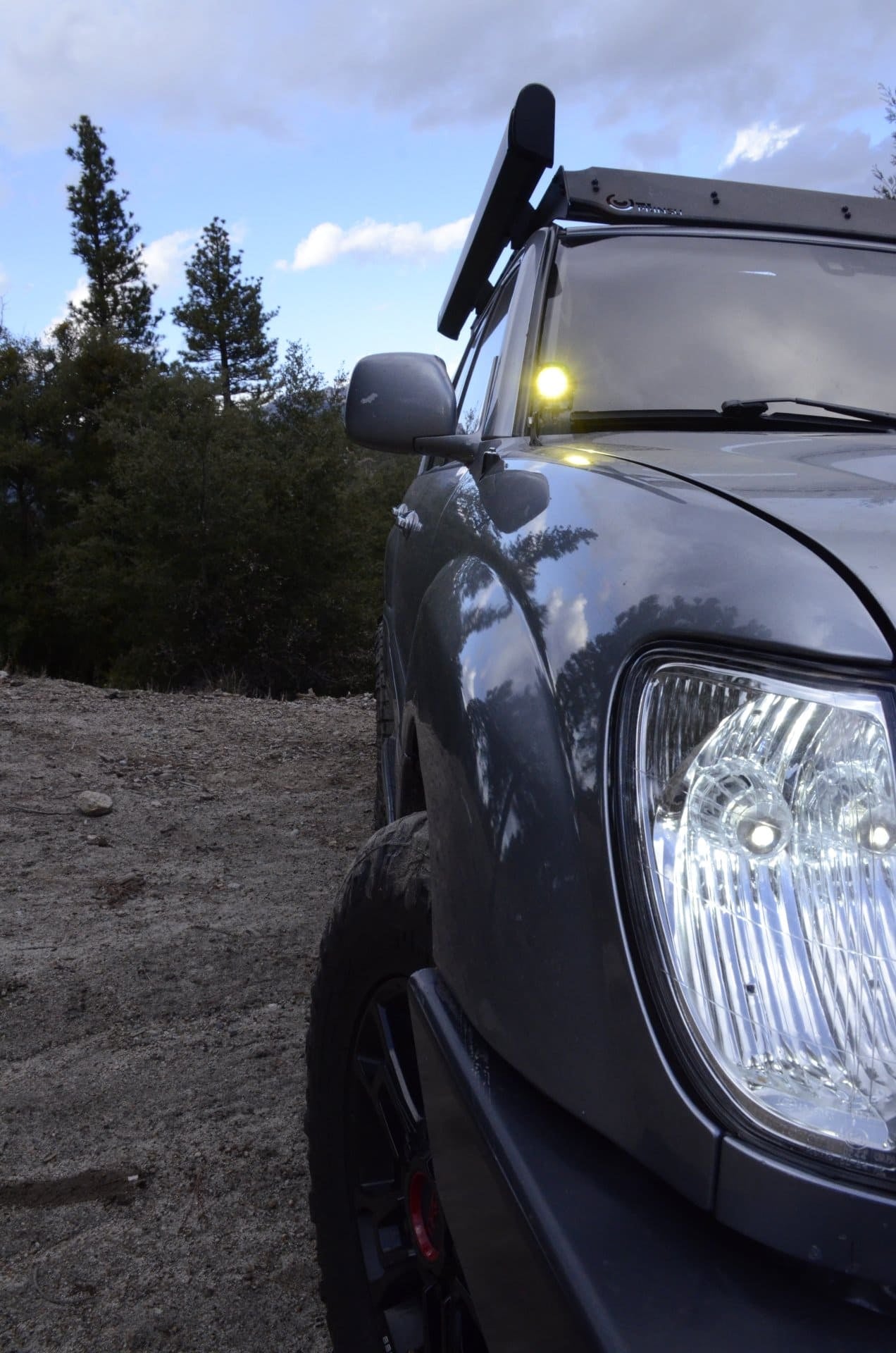 Land Cruiser 100 Series ditch light brackets with amber LED pod lights mounted and wired