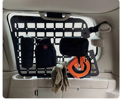 Lexus LX470 or toyota land cruiser 100 MOLLE panel with overland gear, first aid kit, gloves and recovery strap attached for off-road storage mounted on the rear side 3rd window panel