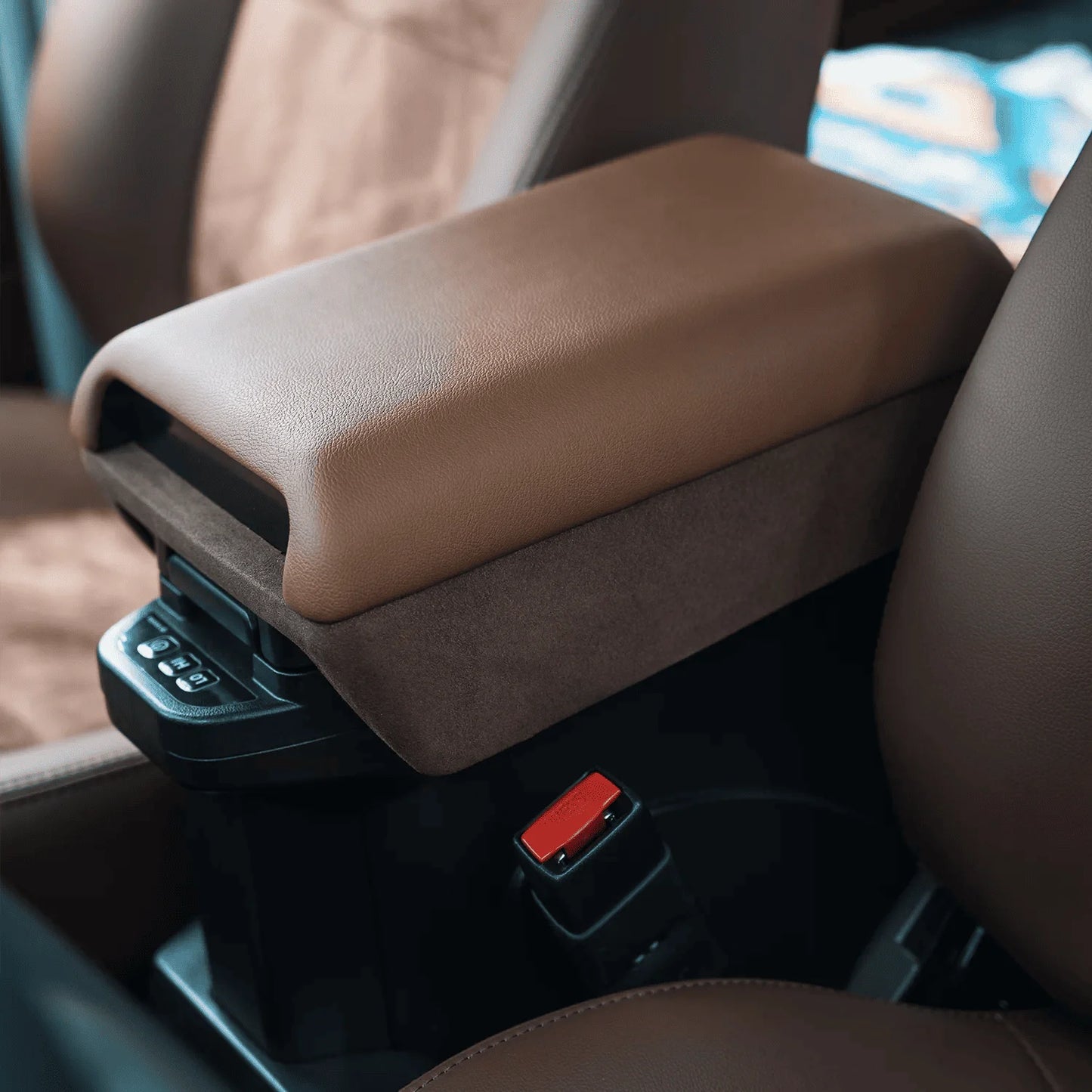 closed up Premium Tan leather Center Armrest Console - Installed in a Land Cruiser 70 Series, showcasing the heightened profile and luxurious leather/velvet finish over the factory fridge console.