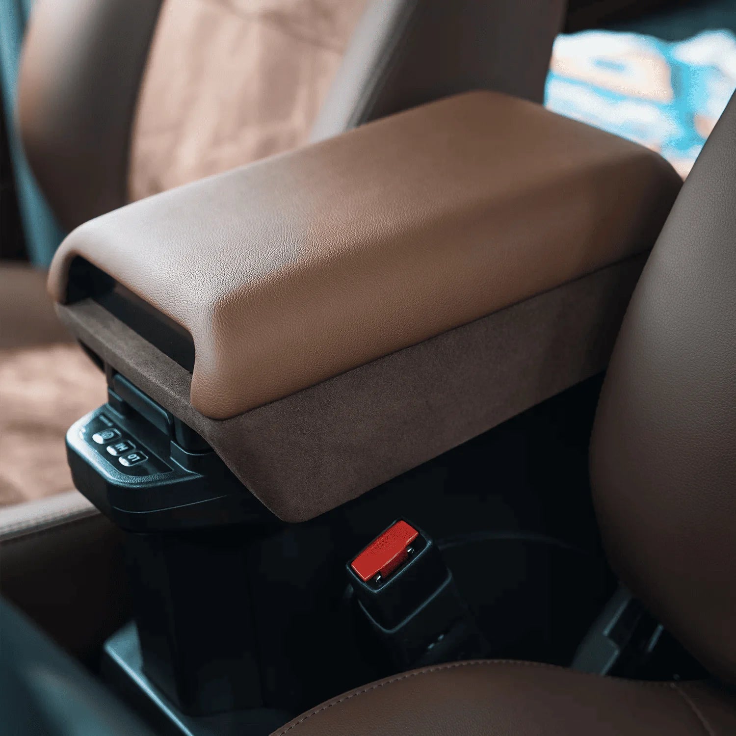 closed up Premium Tan leather Center Armrest Console - Installed in a Land Cruiser 70 Series, showcasing the heightened profile and luxurious leather/velvet finish over the factory fridge console.