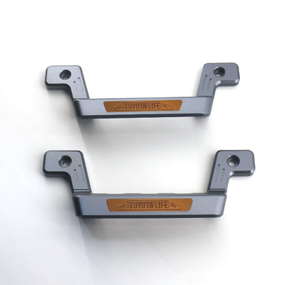 Land Cruiser 70 Series Aluminum Grab Handle Styles - Set of two in gray, front pair with highlighting toyotalife logo in brown and white background
