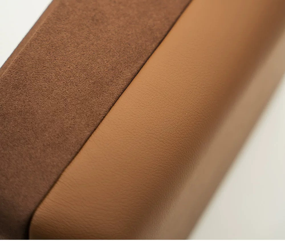 Close-up of brown leather fabric with a subtle texture and velvet suede material