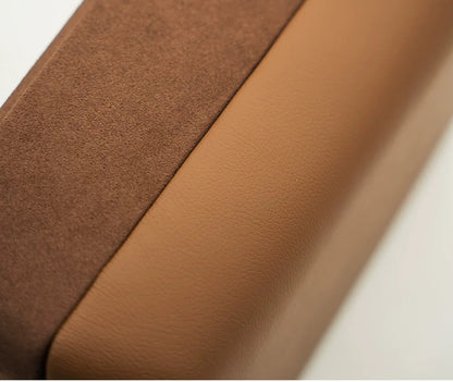 Close-up of brown leather fabric with a subtle texture and velvet suede material