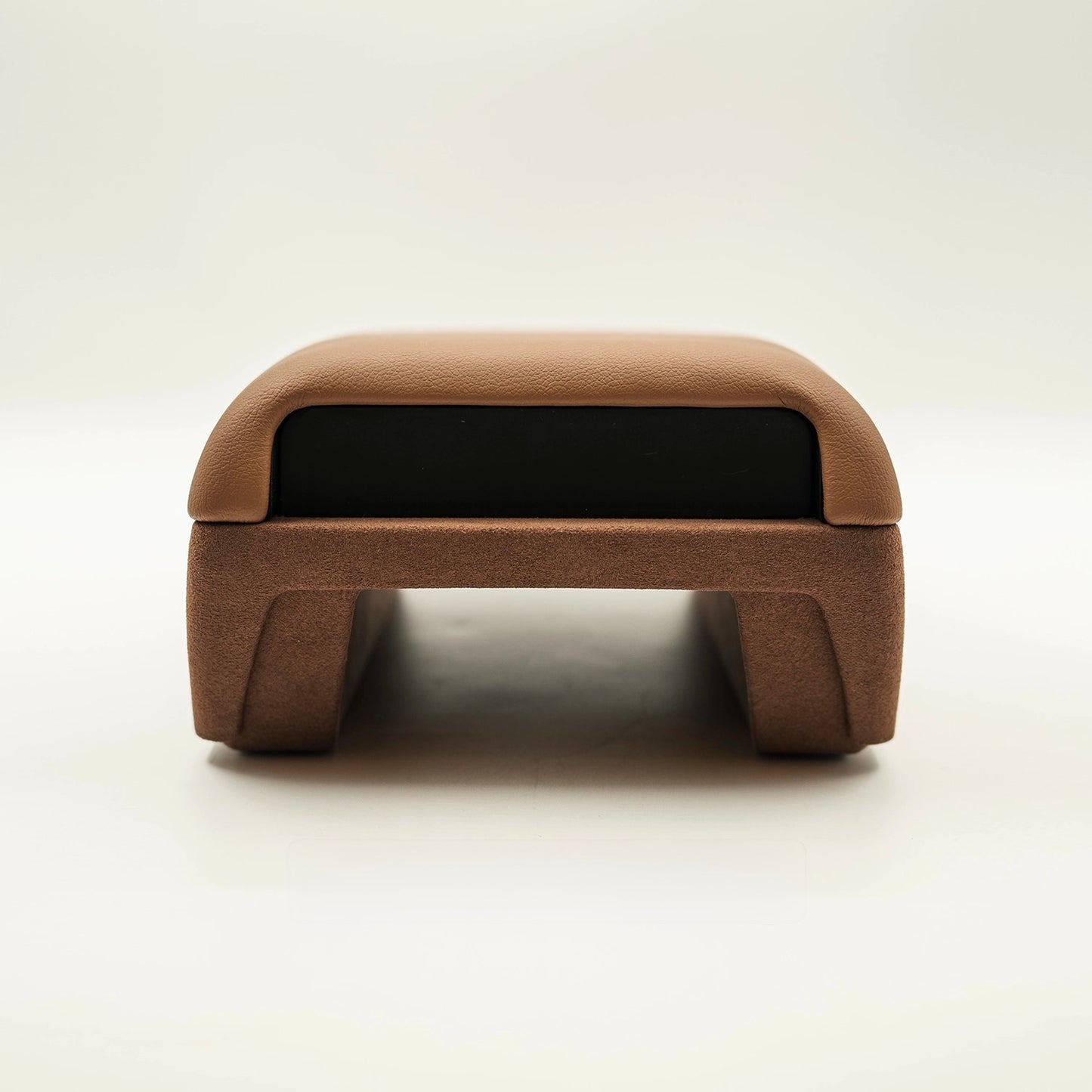 Brown upholstered tan brown leather arm rest glovebox front closed up view with white background