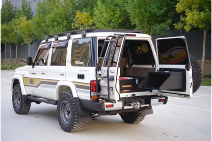 LC76 Land Cruiser 76 Series tailgate MOLLE cargo panel with fold-down extension table installed