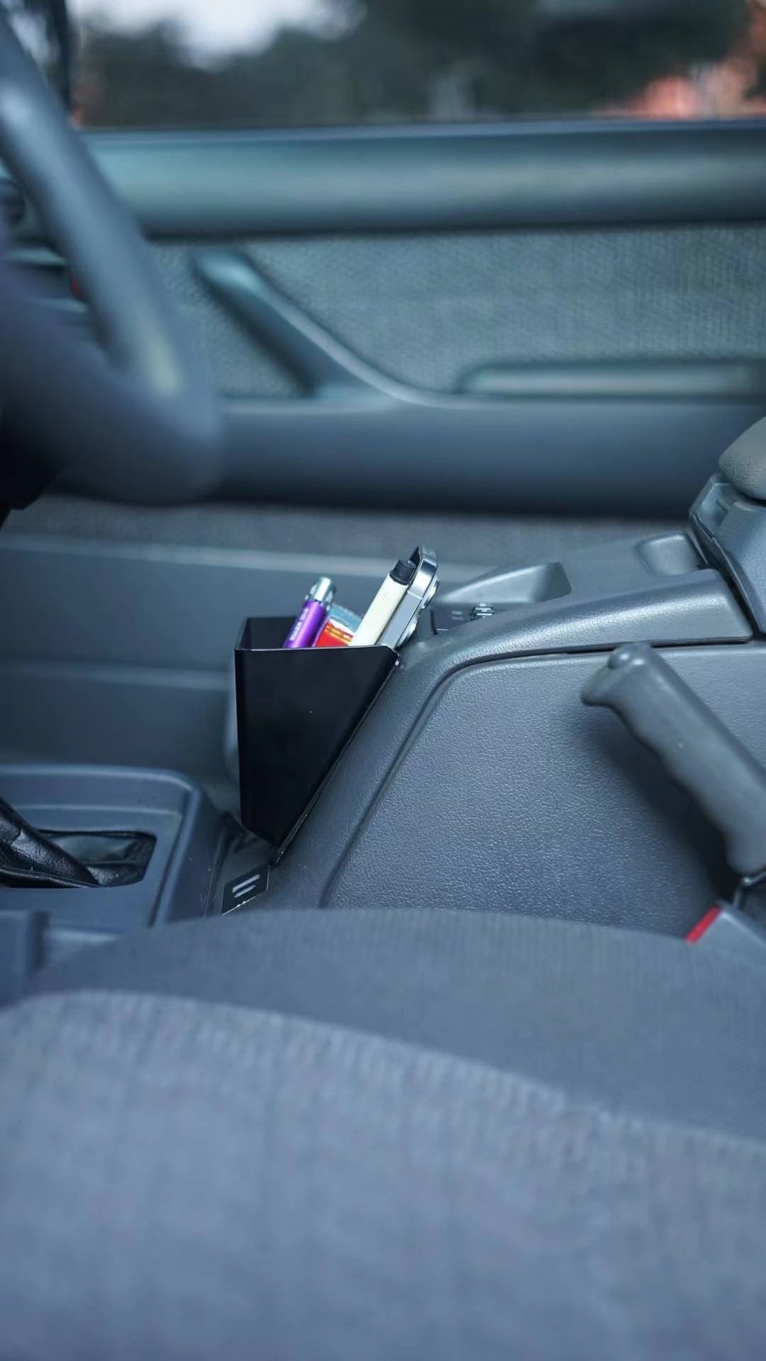 Toyota Land Cruiser 80 Series center console storage box with phone, pens, and accessories – black ABS plastic insert