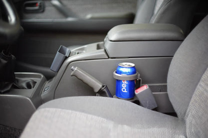 Toyota Land Cruiser 80 Series interior cup holder installed on center console, holding Pepsi can