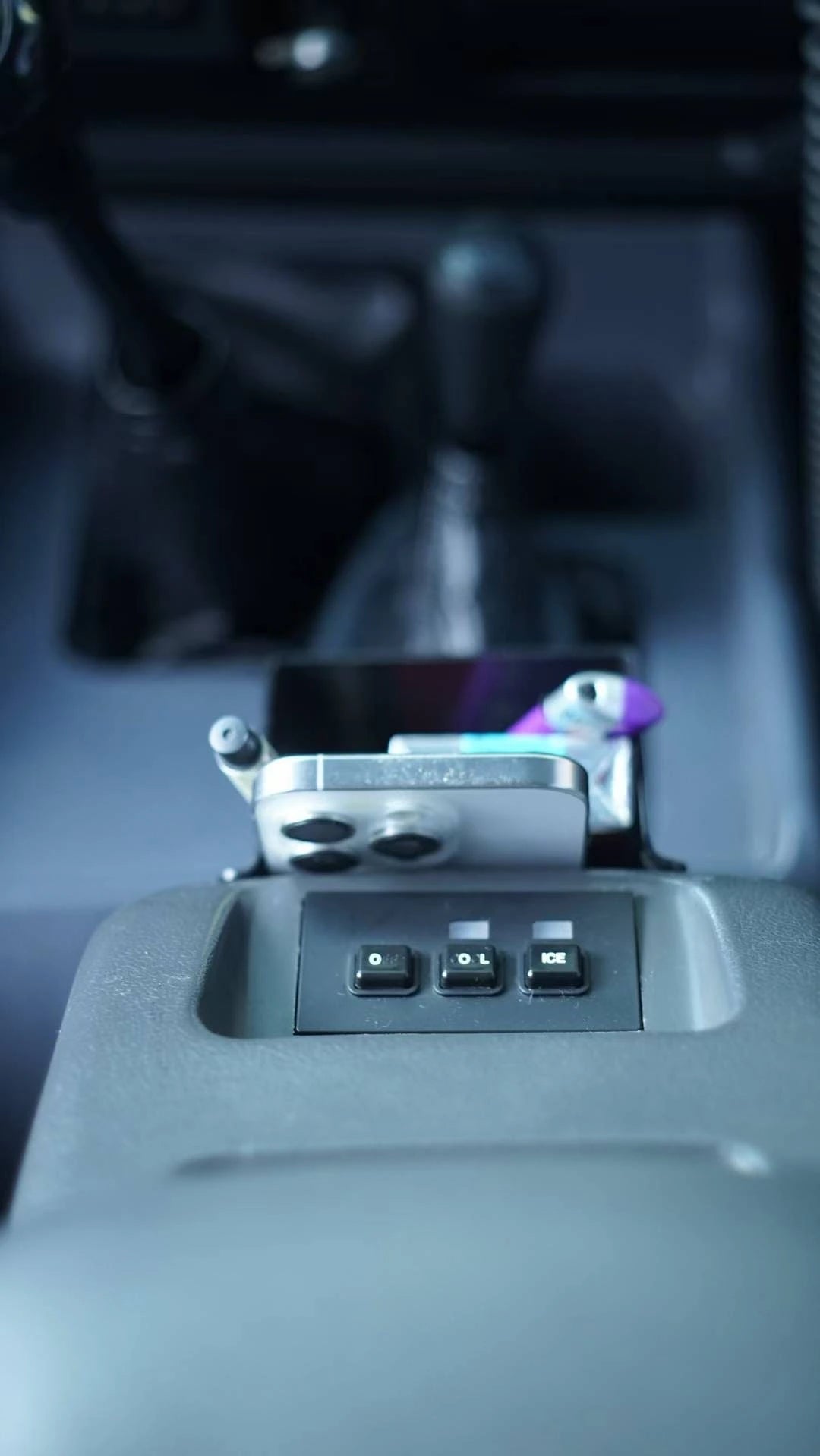 Toyota Land Cruiser 80 Series center console storage box with apple iphone, pens, lighter and accessories – black ABS plastic insert installed on arm rest refrigerator