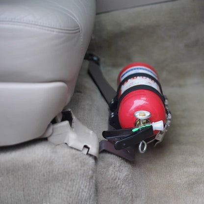 Ninja Cruiser LC100 fire extinguisher bracket mounted under passenger seat of Toyota Land Cruiser 100 Series.