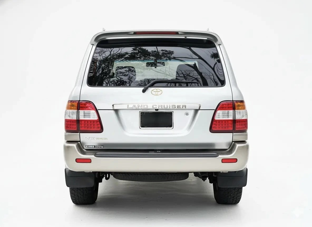 Ninja Cruiser LED tail lights for Toyota Land Cruiser 100 Series (2003-2007) with clear lenses and red/amber LEDs.