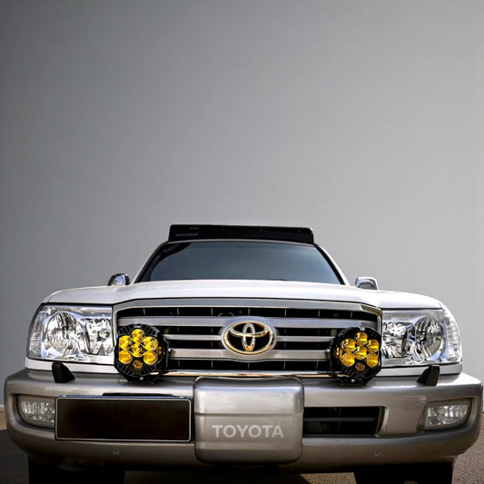 Ninja Cruiser front bumper dual light bracket for Land Cruiser 100 Series & LX470. Heavy-duty steel, black powder coat.