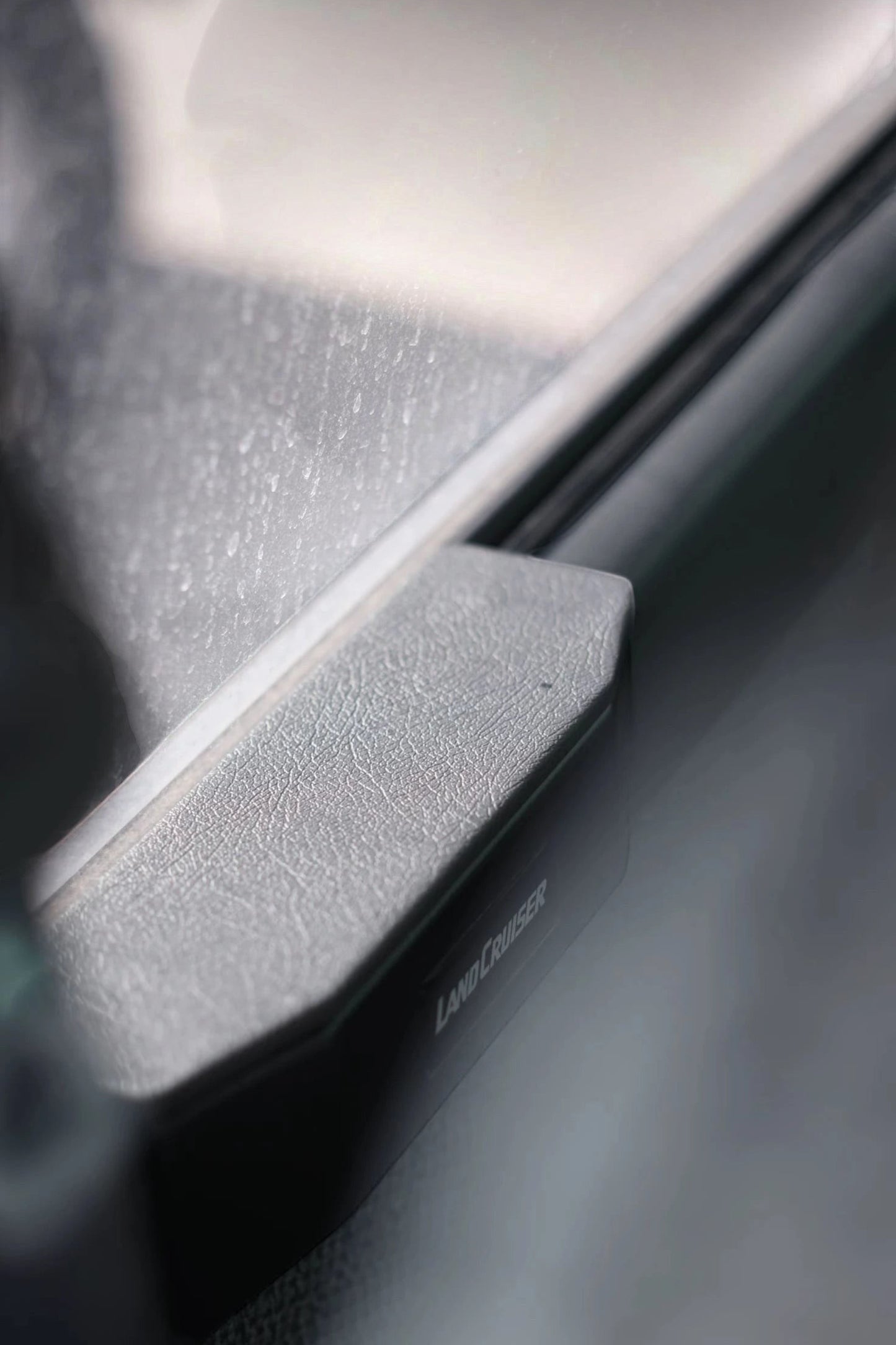 Ninja Cruiser grey synthetic leather padded armrest for Toyota Land Cruiser 80 & Lexus LX450 front door.