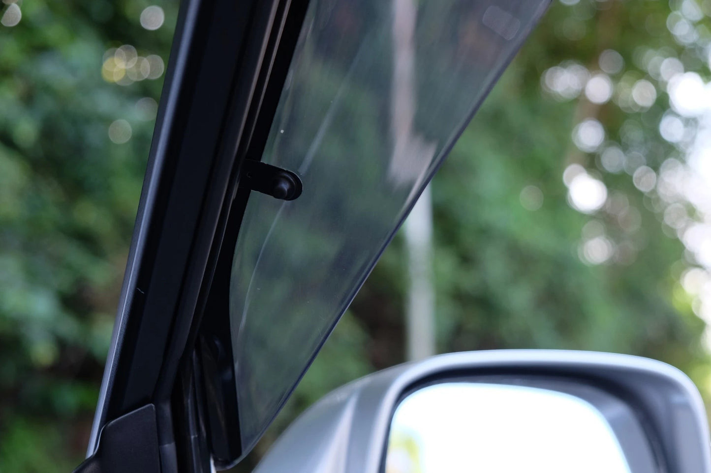 Ninja Cruiser Genuine JDM Toyota Land Cruiser 100 Series window visor, clear acrylic with black trim, for rain and airflow.