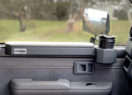 Ninja Cruiser magnetic door armrest and cup holder for Land Cruiser 70 Series, made of ABS plastic with padded top.