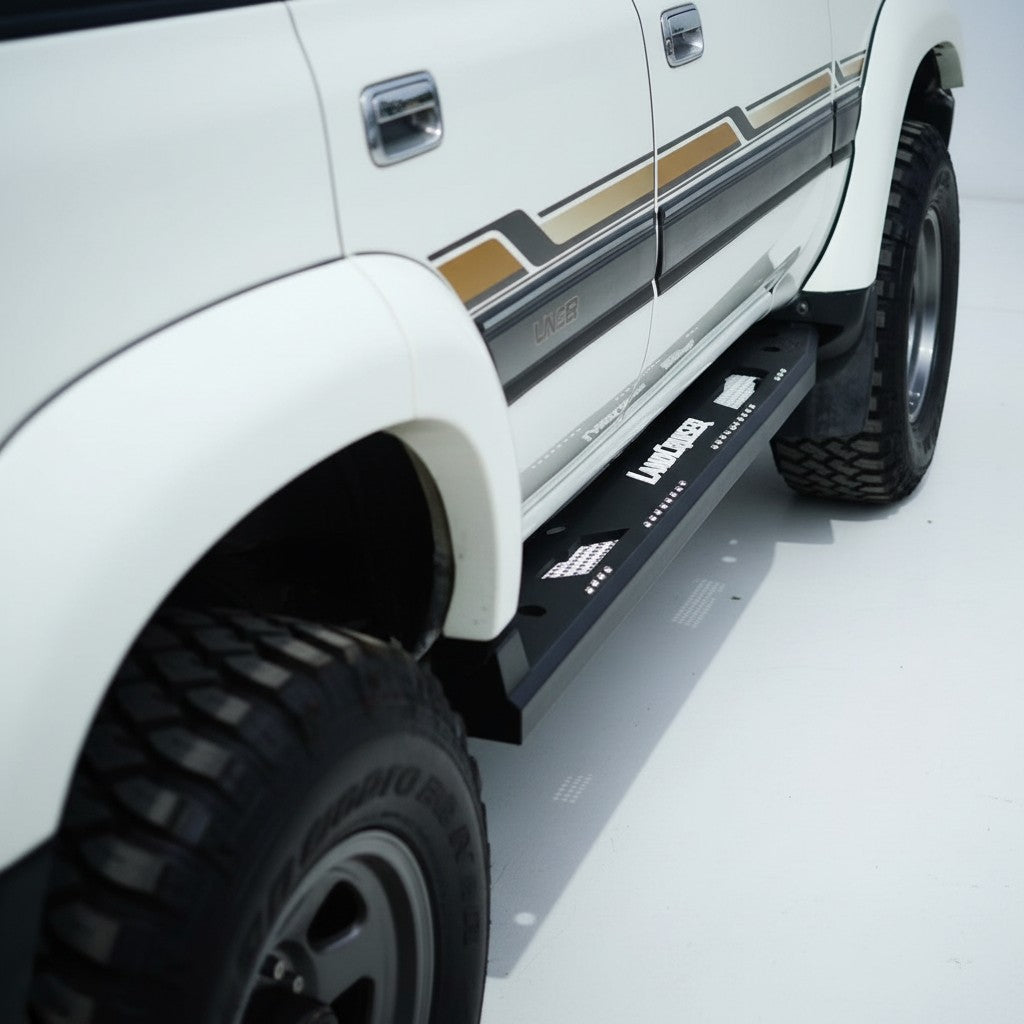 Ninja Cruiser custom aluminum rock slider side step for Toyota Land Cruiser 80 series with white Land Cruiser logo.