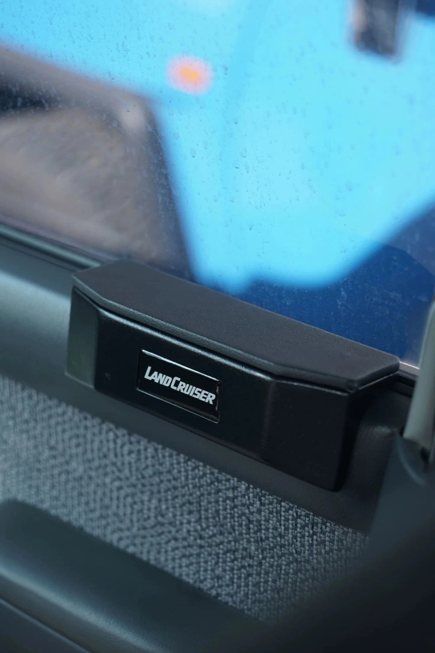 Ninja Cruiser black padded armrest with Land Cruiser logo for Toyota Land Cruiser 80 & Lexus LX450 front doors.