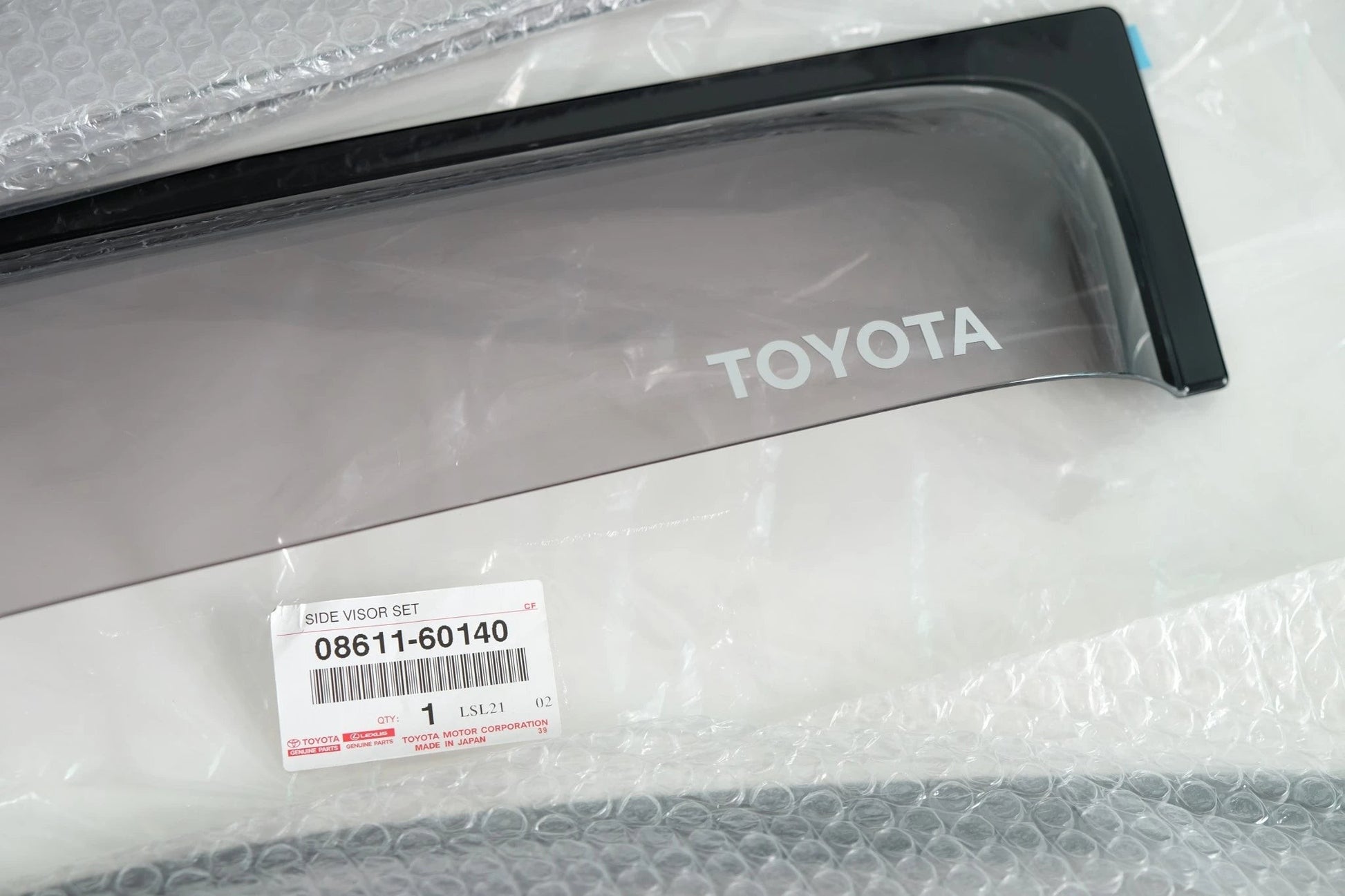 Ninja Cruiser Genuine Toyota JDM dark smoke side window visors for Land Cruiser 100 Series & LX470. OEM part 08611-60140.