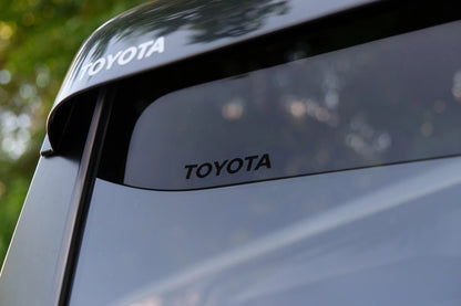 Ninja Cruiser Genuine Toyota JDM window visors for Land Cruiser 100 Series & LX470. Dark tinted acrylic rain guards.