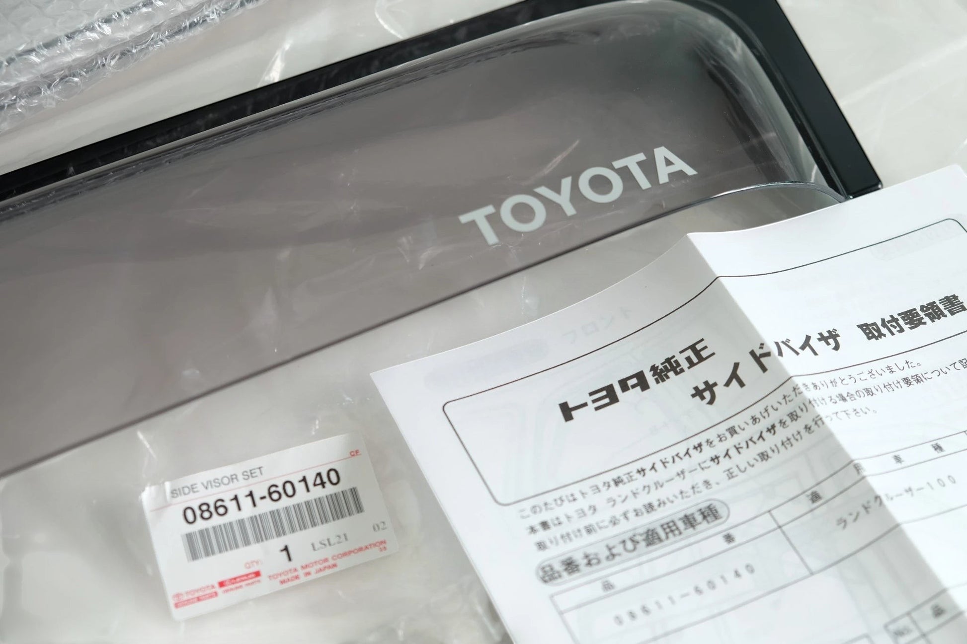 Ninja Cruiser Genuine Toyota JDM dark smoke window visors for Land Cruiser 100 Series & LX470. Includes instructions.
