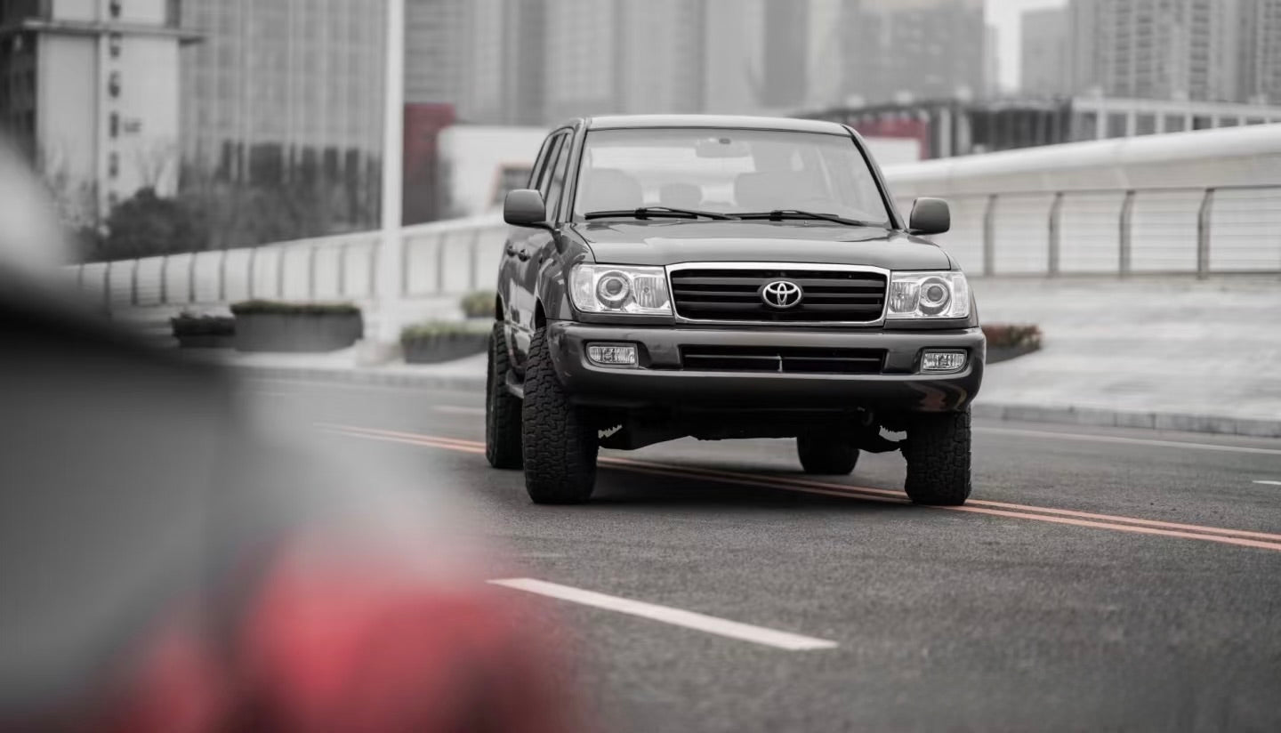 Front view of Land Cruiser 100 Series showcasing LED projector headlight upgrade