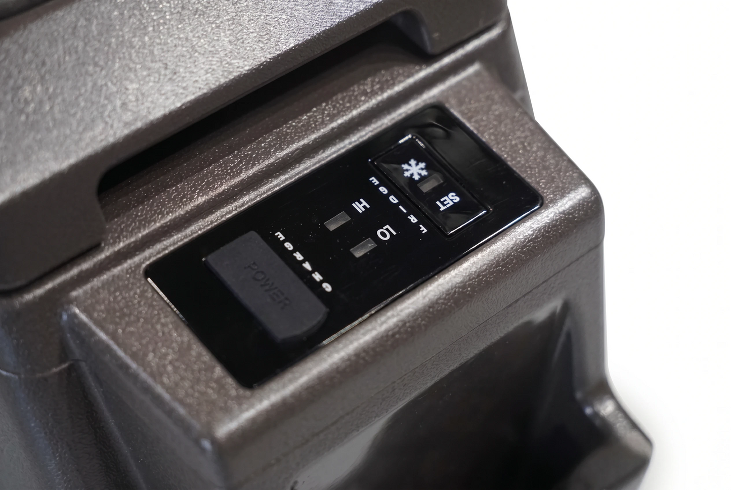 Toyota Land Cruiser 70 Series centre console fridge control panel showing power, temperature and cooling settings in brown