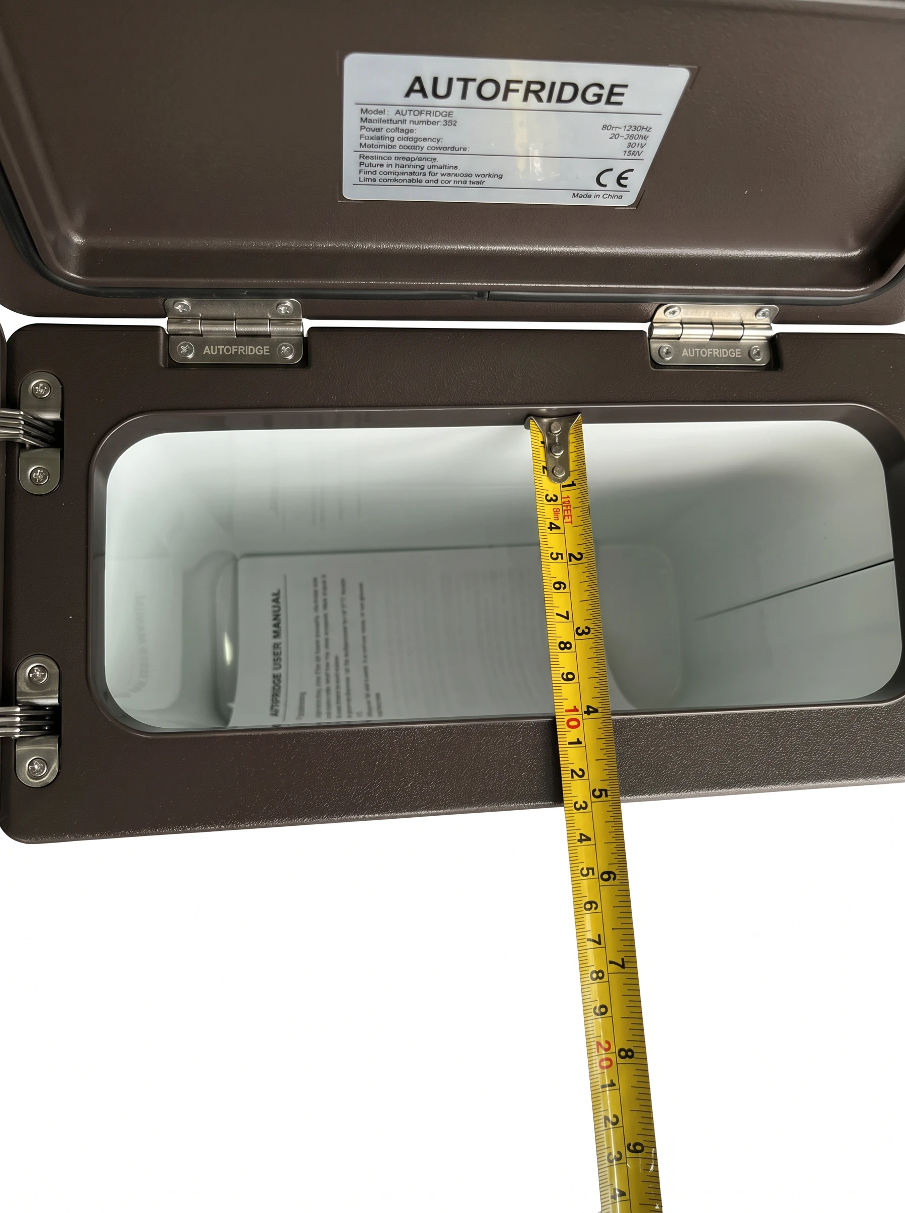 Toyota Land Cruiser 70 Series console fridge open lid showing interior depth and autofridge label