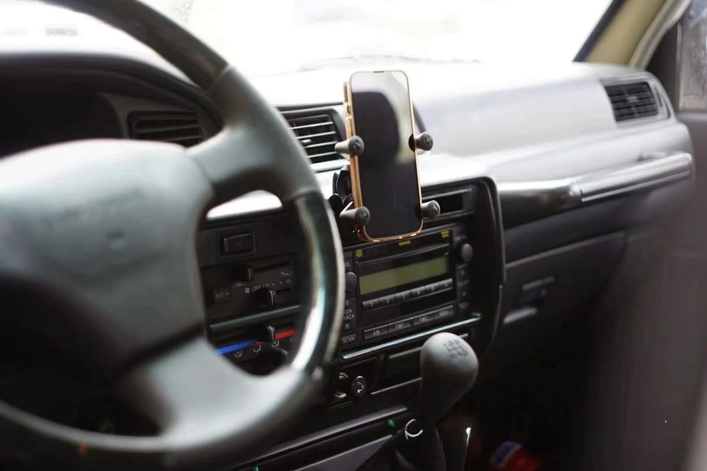 Toyota Land Cruiser 80 Series Lexus LX450 single dash mount for phone or CB radio – interior accessory holder front view