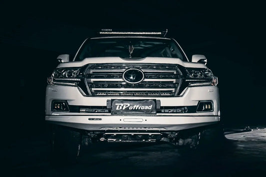 White facelift toyota lc200 with 'BP Offroad' branding front white bumper on a dark background